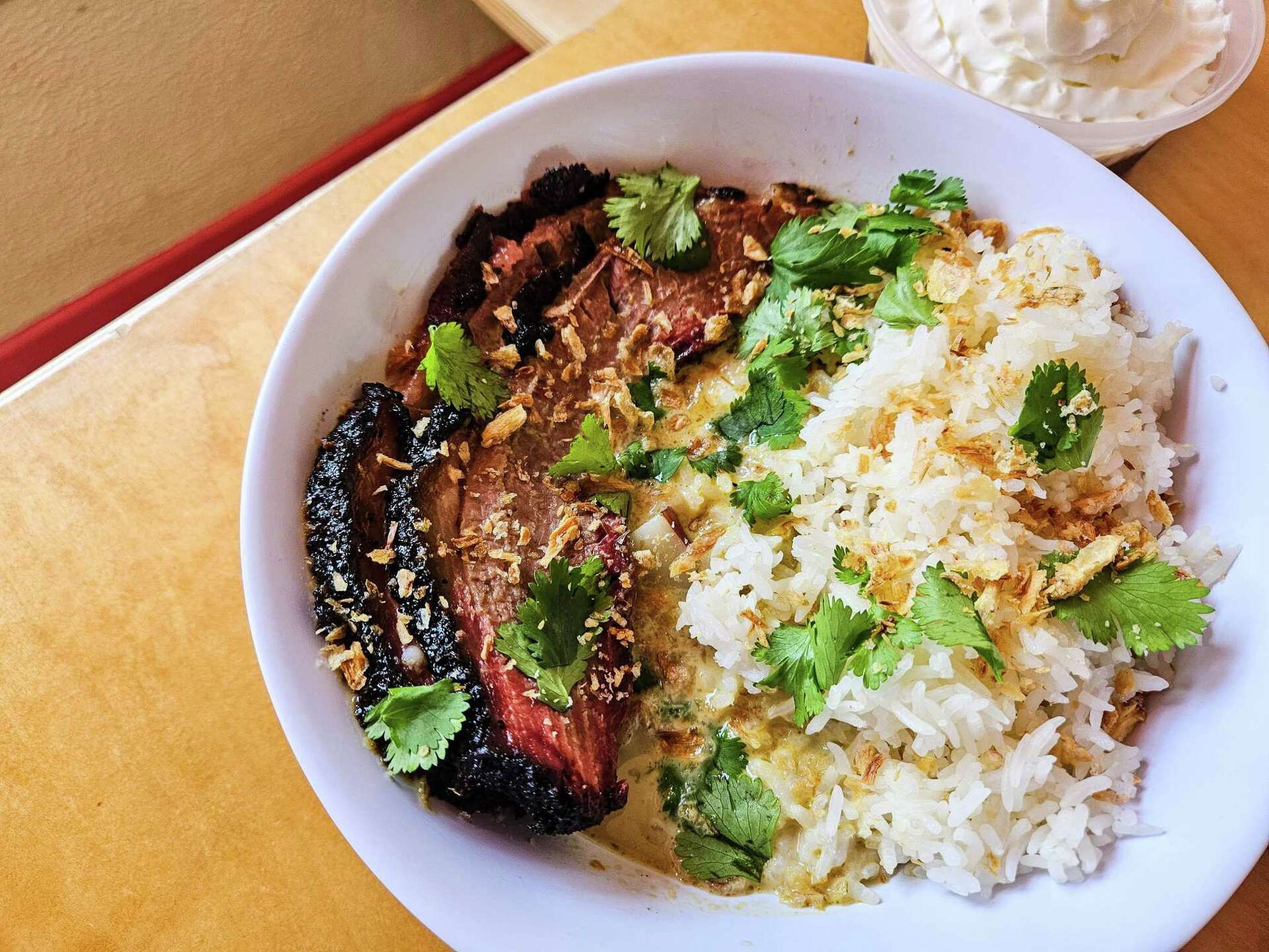 Curry Boys BBQ signature dishes Brisket Smoke Show, The Tony Porker, The Missing Link.